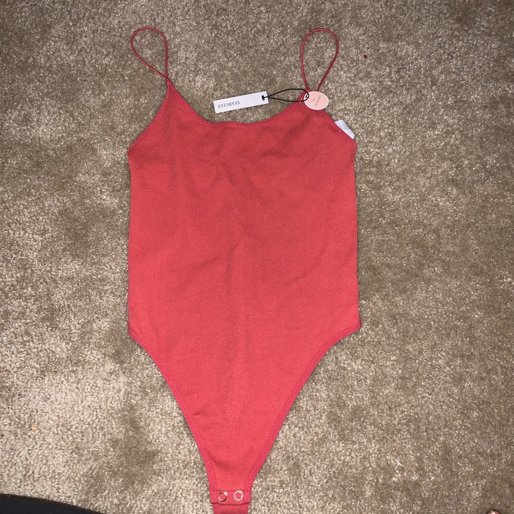 Seamless orange bodysuit